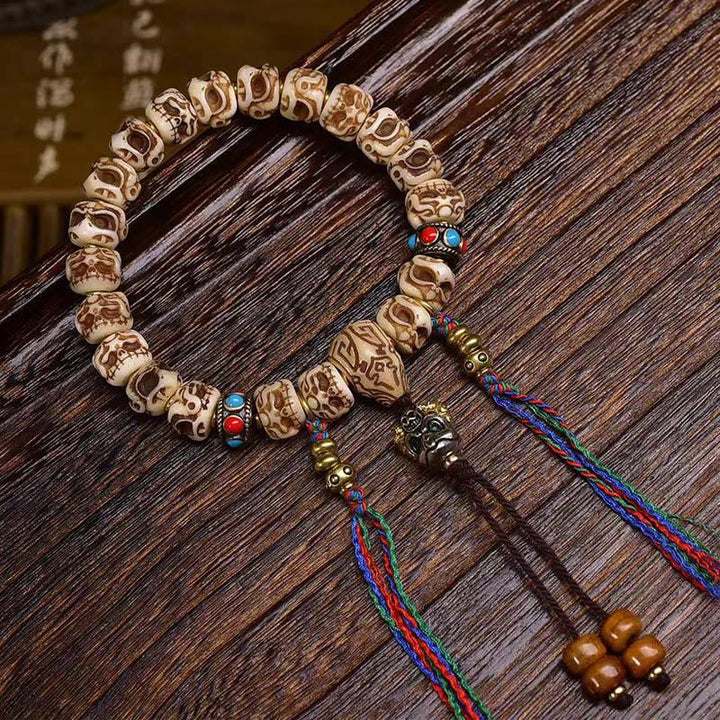 Buddha Stones Tibetan Camel Bone Garuda Carved Protection Tassel Bracelet - image 1