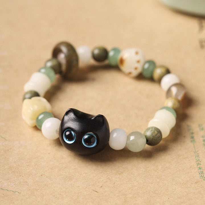 Buddha Stones Bodhi Seed Green Sandalwood Ebony Wood Small Leaf Red Sandalwood Cat Head Paw Claw Peace Bracelet - Ebony Wood Cat(Blue Eyes)(Wrist Circumference 14-16cm) - image 0