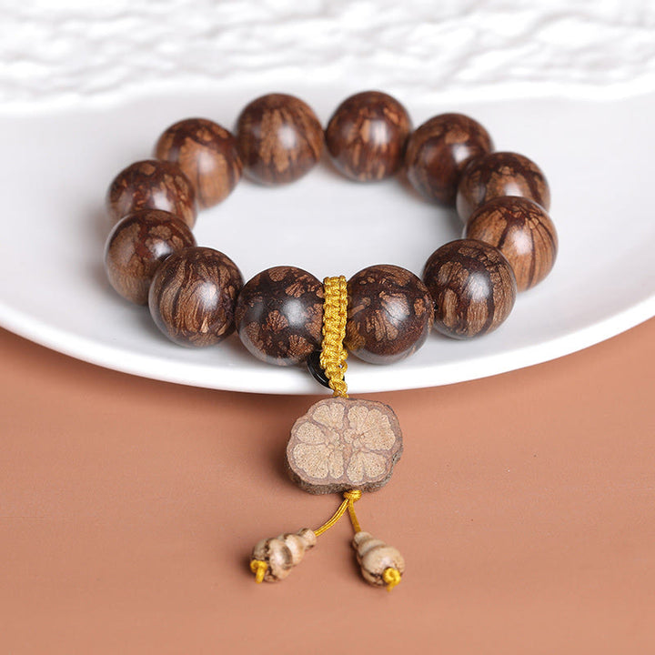 Buddha Stones Plum Blossom Wood Inner Peace Bracelet - image 1