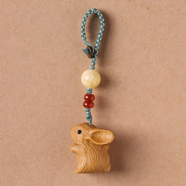 Buddha Stones Sandalwood Small Leaf Red Sandalwood Lucky Mini Rabbit Protection Key Chain Phone Hanging Decoration - image 1