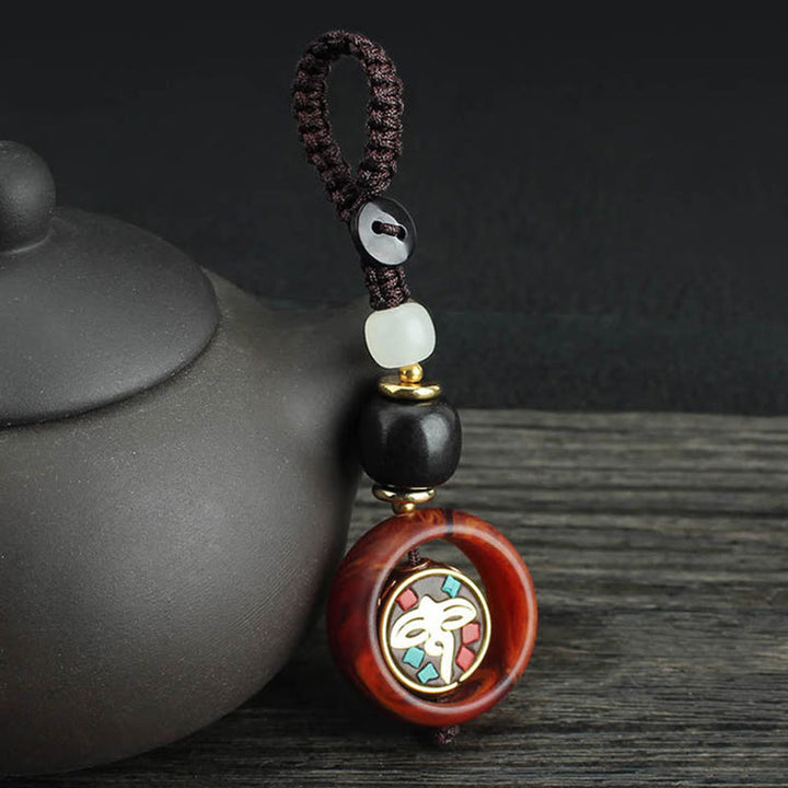 Buddha Stones Ebony Wood Sanskrit Four-leaf Clover Buddha's Eye Peace Rotatable Key Chain - Buddha's Eye Pattern - image 6