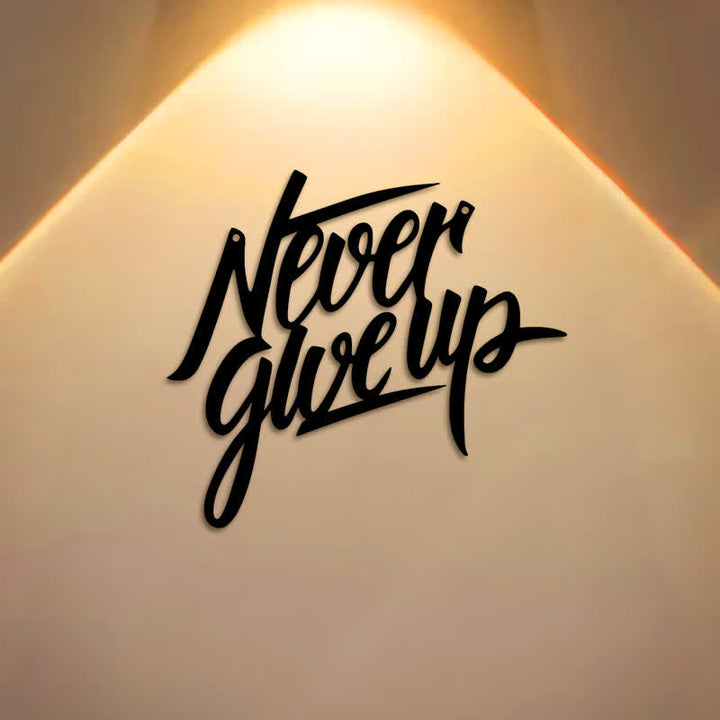 Buddha Stones "Never Give Up" Black Script Iron Metal Wall Decor - image 0