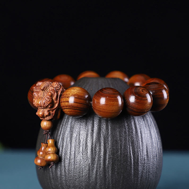 Buddha Stones Rosewood Green Sandalwood Small Leaf Red Sandalwood Dragon Carved Protection Bracelet - Rosewood - image 0